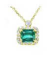 Emerald jewelry necklace east west orientation in a halo of natural diamonds, 14k yellow gold