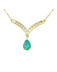Natural pear cut emerald necklace: this natural Muzo Colombian gem is dangling from a channel set diamonds chevron design