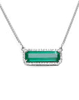 A natural emerald necklace white gold with a halo diamond pendant.
