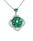 14K white gold cluster necklace with natural Colombian emeralds and diamond clover silhouette.