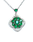 14K white gold cluster necklace with natural Colombian emeralds and diamond clover silhouette.