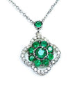14K white gold cluster necklace with natural Colombian emeralds and diamond clover silhouette.