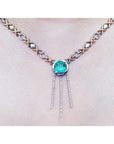 14K white and yellow gold Kisses and Hugs necklace with a square emerald pendant and diamond dangles.