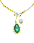 Front side of a Colombian emerald gold necklace deep green hue teardrop pendant halo diamond on a white background