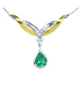 14K white/yellow gold necklace with a pear-shaped Colombian emerald and diamond chevron design.
