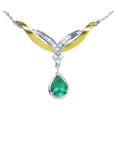 14K white/yellow gold necklace with a pear-shaped Colombian emerald and diamond chevron design.