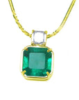 Front view of a 18k yellow gold necklace with a Asscher cut emerald pendant on a white background