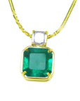 Asscher cut Colombian emerald necklace with a princess cut diamond on an 18K yellow gold chain.