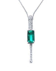 Front view of a 14k white gold emerald necklace natural Muzo mines with straight row of natural diamonds in a white background