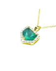 1.75 ct Colombian emerald pendant with diamond halo on a 14K gold chain.
