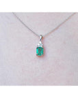 0.27 ct emerald pendant necklace with a vibrant green emerald and diamonds in 14K white gold.