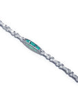 White gold bracelet with vibrant Colombian emeralds and princess-cut diamonds.