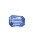 Genuine loose sapphire medium light blue emerald-cut, front-right side position table and crown visibles
