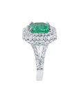 4.14 ct GIA-certified F1 Colombian emerald ring with diamond halo and split shank in 14K white gold.