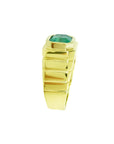 Men's 18K yellow gold ring with a rectangular, medium-deep green emerald in a full bezel setting.