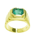Men's 18K yellow gold ring with a rectangular, medium-deep green emerald in a full bezel setting.