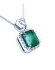 A GIA certified F1 colombian emerald pendant, crafted in 18k white gold.