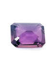 4.05 ct natural loose pink sapphire with an emerald cut, displaying a clear purple hue.
