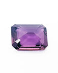4.05 ct natural loose pink sapphire with an emerald cut, displaying a clear purple hue.