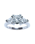 This GIA-certified radiant cut diamond ring features a 0.77 ct center stone and 0.47 ct trillion-cut side stones, for a total weight of 1.24 ct.