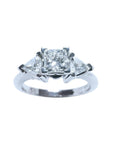 This GIA-certified radiant cut diamond ring features a 0.77 ct center stone and 0.47 ct trillion-cut side stones, for a total weight of 1.24 ct.