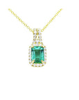 14K gold emerald-cut Colombian emerald necklace with halo diamonds on a delicate chain.