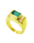 Men's 14K yellow gold ring with an east-west emerald-cut Colombian emerald and channel-set diamonds.