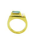 Men's 14K yellow gold ring with an east-west emerald-cut Colombian emerald and channel-set accent diamonds.