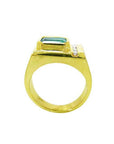 Men's 14K yellow gold ring with an east-west emerald-cut Colombian emerald and channel-set accent diamonds.