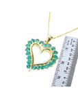 1.42 ct. emerald heart pendant necklace with 14K gold chain, shown with ruler for size.