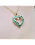14K gold heart pendant necklace with brilliant round Colombian emeralds.