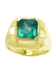 A 18k yellow gold men's ring with a natural square colombian emerald in bezel set.