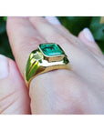 18K yellow gold men's solitaire ring with a square emerald cut Muzo Colombian emerald in a full bezel setting.