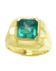 A yellow gold men's ring with a natural square colombian emerald in bezel set displaying the topside view.