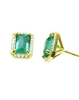 Yellow gold earrings with natural emeralds gemstones on a front and side positions for an underside view