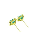 Emerald stud earrings with diamond halo in 14k yellow gold.