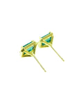 Emerald stud earrings with diamond halo in 14k yellow gold.