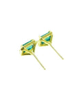Emerald stud earrings with diamond halo in 14k yellow gold.