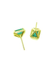 Emerald stud earrings with diamond halo in 14k yellow gold, featuring baguette-cut emeralds.