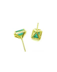 Emerald stud earrings with diamond halo in 14k yellow gold, featuring baguette-cut emeralds.