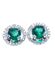 Pair of halo diamond emerald stud earrings, top view on a front position