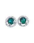 Pair of halo diamond stud earrings with natural Muzo Colombia emeralds, on a top view.