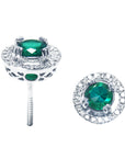 Pair of 14k white gold halo diamond emerald stud earrings, downside and top view positions.
