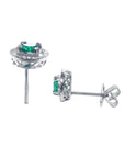 1.06 ct deep bluish-green emerald stud earrings in 14K white gold with diamond halo and screw backs.