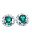 Pair of halo diamond and natural colombian emerald stud earrings in 14k white gold.