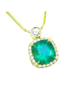 Natural emerald necklace 8.07 carats encircled in a halo of natural diamonds 18k yellow gold.