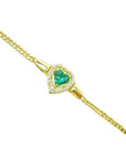 14K yellow gold bracelet with a heart-shaped emerald center surrounded by diamonds.