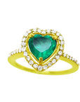 The topside view of a heart cut emerald engagement ring halo diamonds 14k yellow gold.