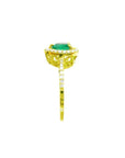 14K yellow gold heart-cut emerald ring with diamond halo and pavé band.