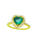 A heart cut emerald engagement ring with a halo diamonds 14k yellow gold.
